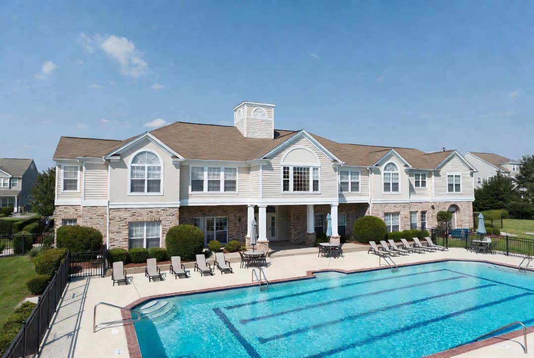 HOA clubhouse and pool deck at a residential community